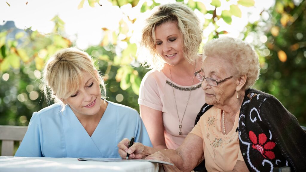 Health Care worker with senior patient and family